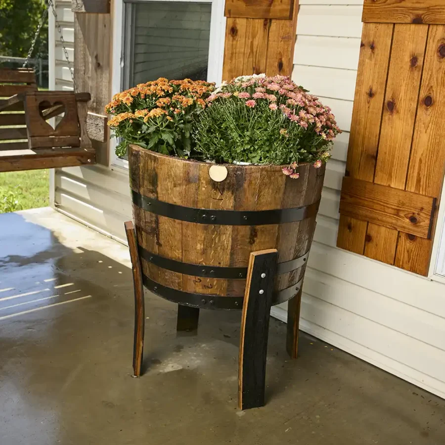 Barrel planter on stave legs to elevated it off the ground