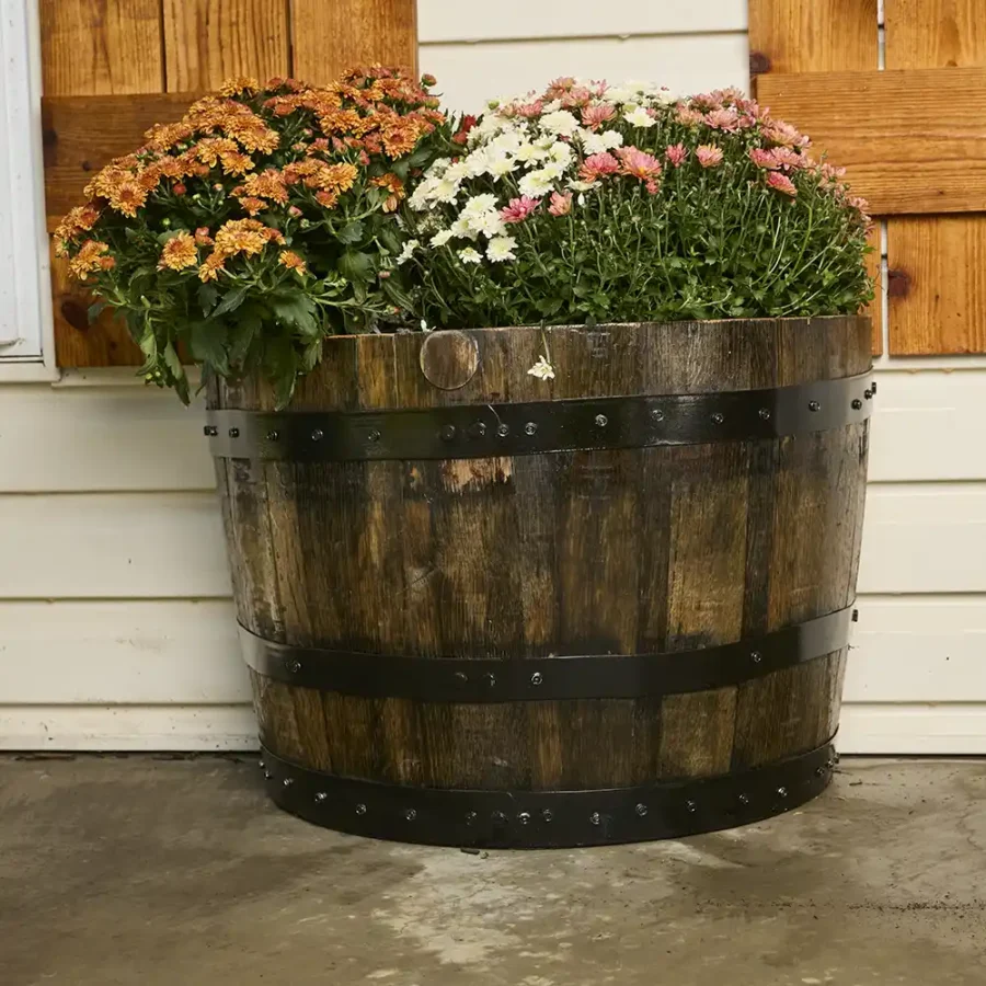 quarter whiskey barrel planter with metal rings painted black