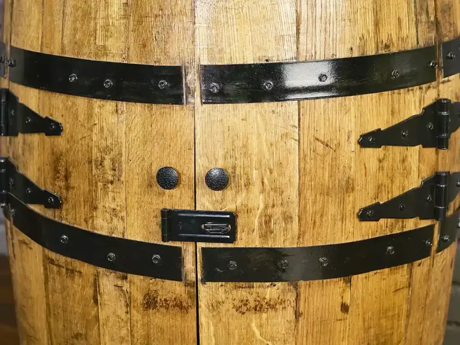Close up of locking mechanism on whiskey barrel cabinet with doors