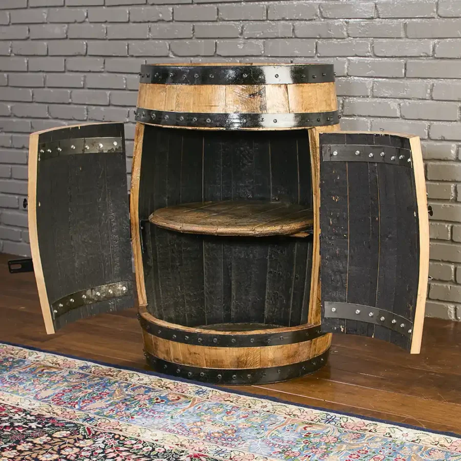 Bourbon Whiskey barrel cabinet with doors and lights turned off. Barrel lid used for a shelf