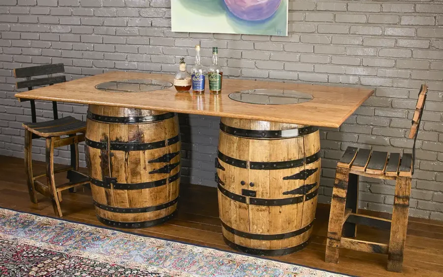 Two whiskey barrels cabinets with doors with handmade solid oak tabletop with 2 glass inserts to show the distillery stamps on the barrel.