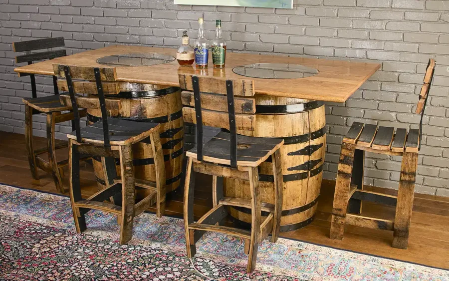 Two bourbon barrel cabinets with doors used as a base for a solid oak tabletop. Barrel stave chairs with backrest around the table