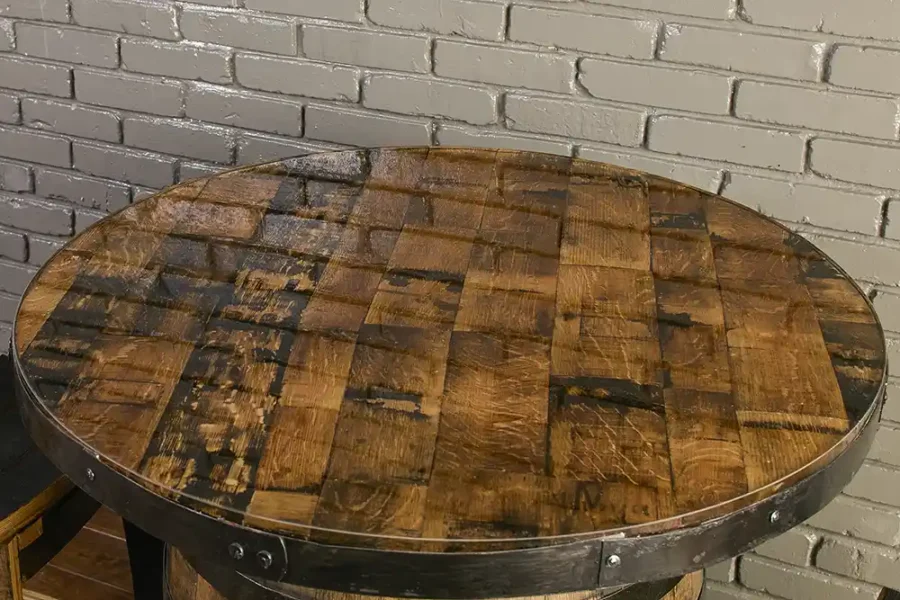 table top made from barrel staves and epoxy resin. Metal rings from the barrel secured to the edge and painted black.
