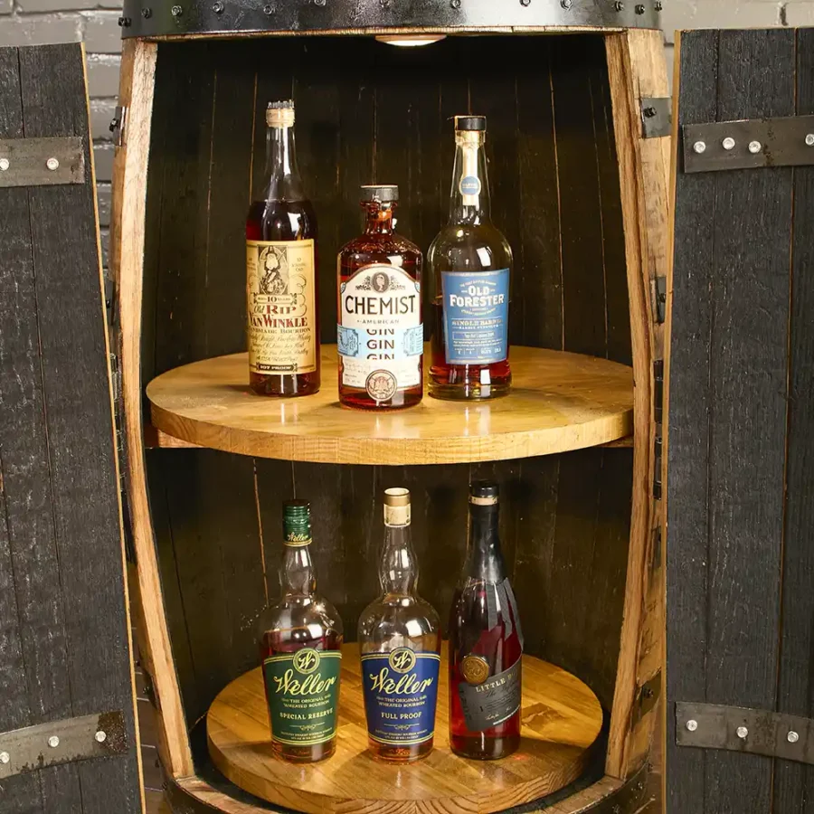 Bourbon Whiskey barrel cabinet with tall doors, 2 rotating lazy susans, and lights. Bottles on both shelves
