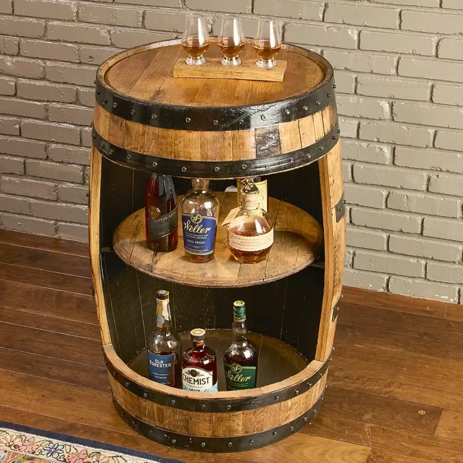Whiskey barrel cabinet with lights and a barrel lid shelf. Bottles inside the cabinet