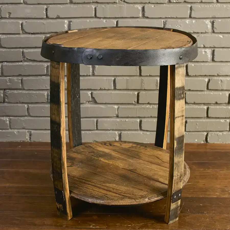 whiskey barrel end table handmade with 2 barrel lids for shelves, staves for legs, and metal hoops that painted black.