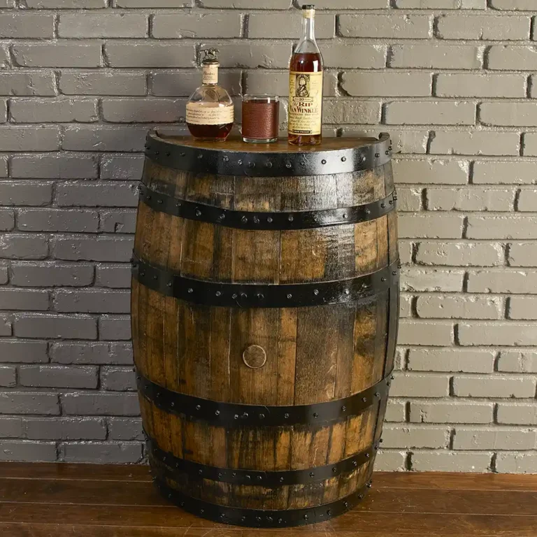 half refinished bourbon whiskey barrel with metal rings painted black