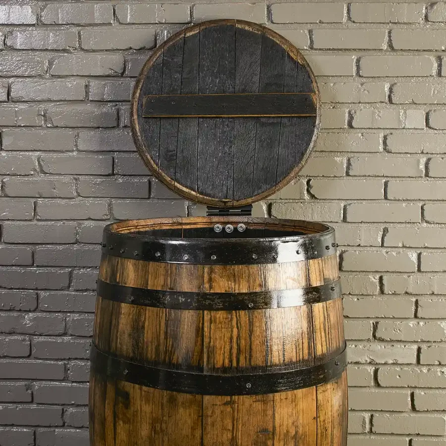 Whiskey barrel trash can cover with lid open.