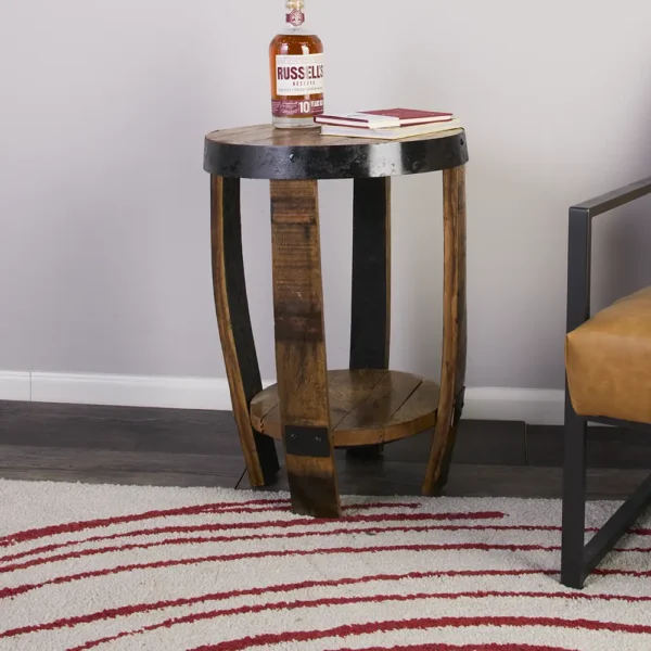 Bourbon bottle on top of the miniature barrel table with shelf. Black metal rings used to accent the item.