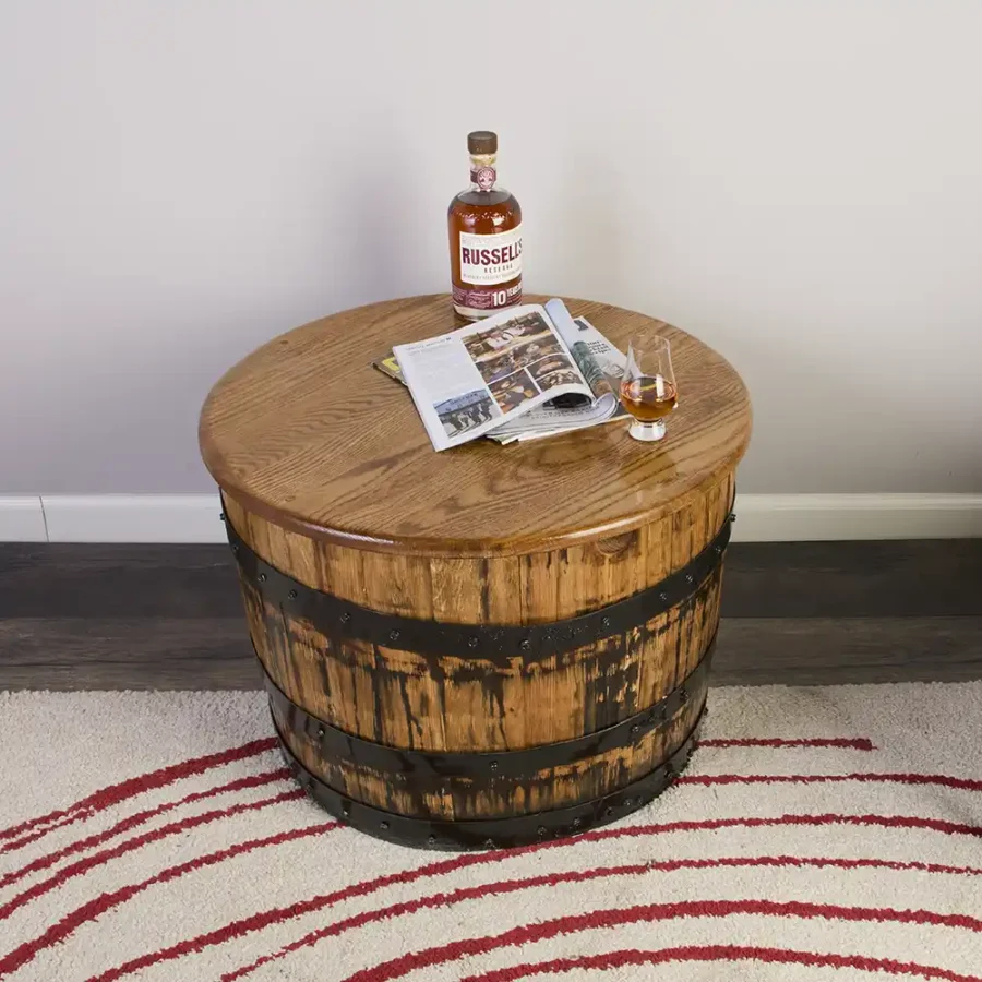half barrel coffee table with magazine and whiskey bottle on oak top