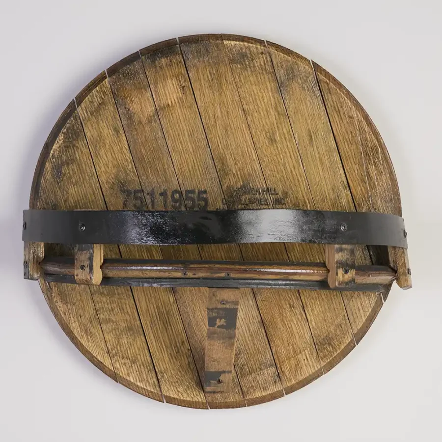Empty bourbon barrel head shelf with black metal ring