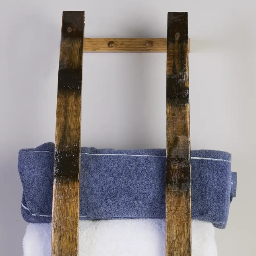 Close up of barrel stave towel rack showing oak plugs that cover screw heads