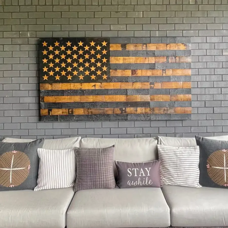 Barrel stave American Flag hanging on a brick wall