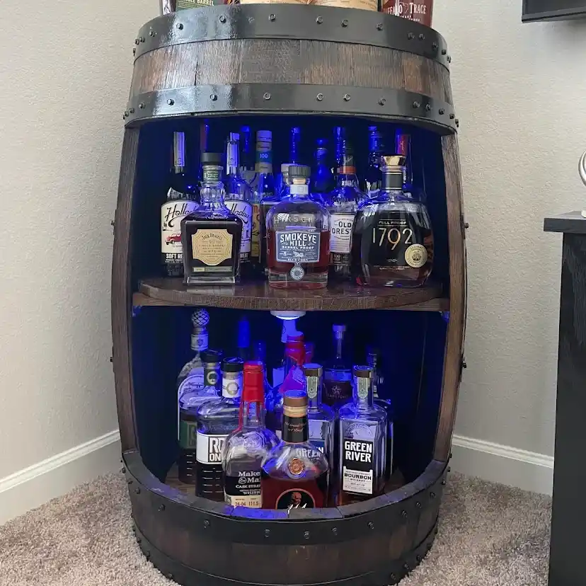 Whiskey barrel cabinet with dark stain, internal lighting, and lazy susans
